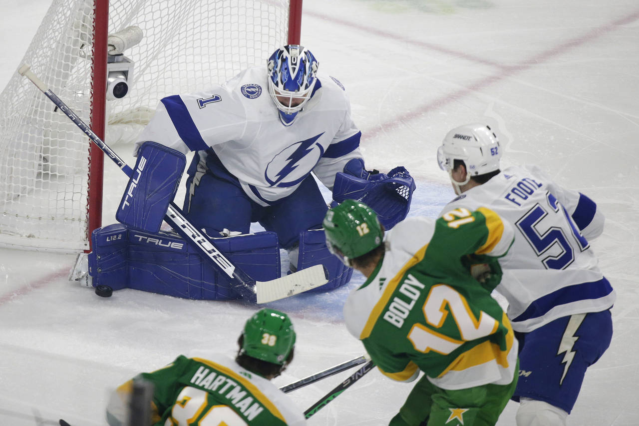 Tampa Bay Lightning goaltender Brian Elliott (1) stops a shot by Minnesota Wild left wing Matt Bold...