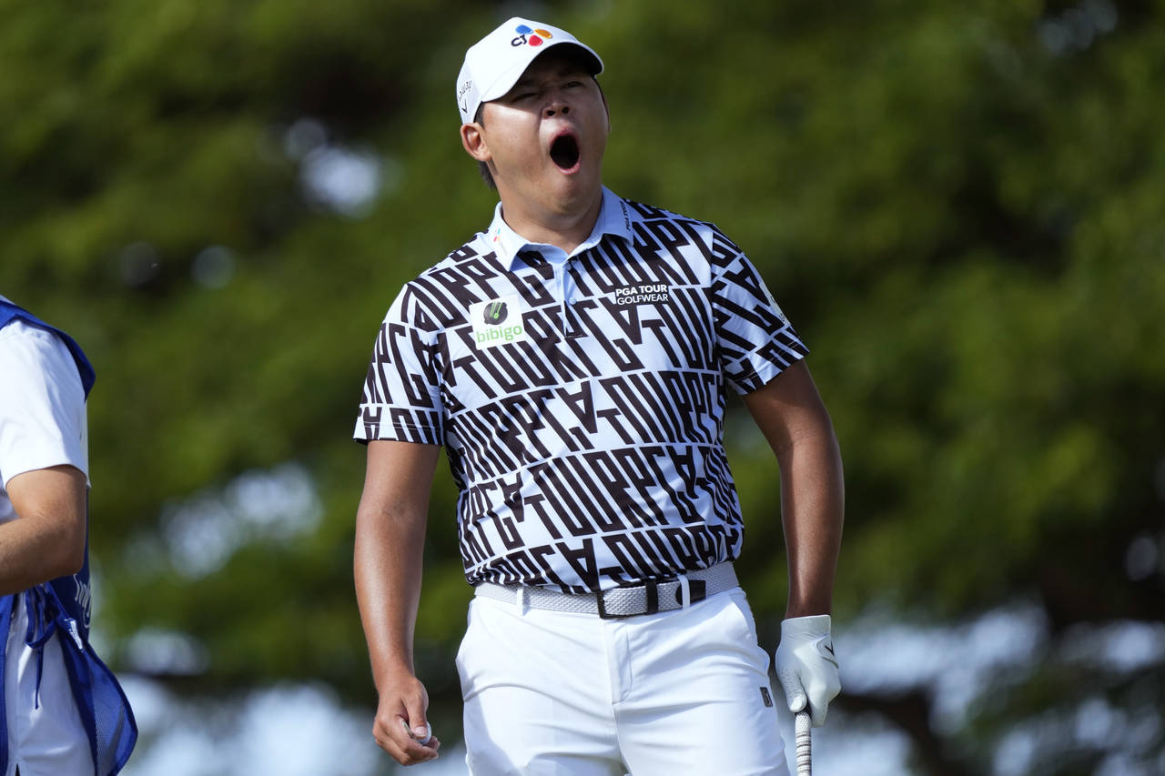 Si Woo Kim yawns on the second tee during the final round of the Sony Open golf tournament, Sunday,...
