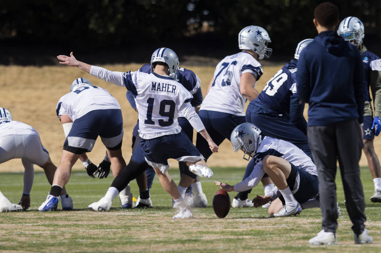 Dallas Cowboys place kicker Brett Maher (19) kicks during an NFL football practice Thursday, Jan. 1...