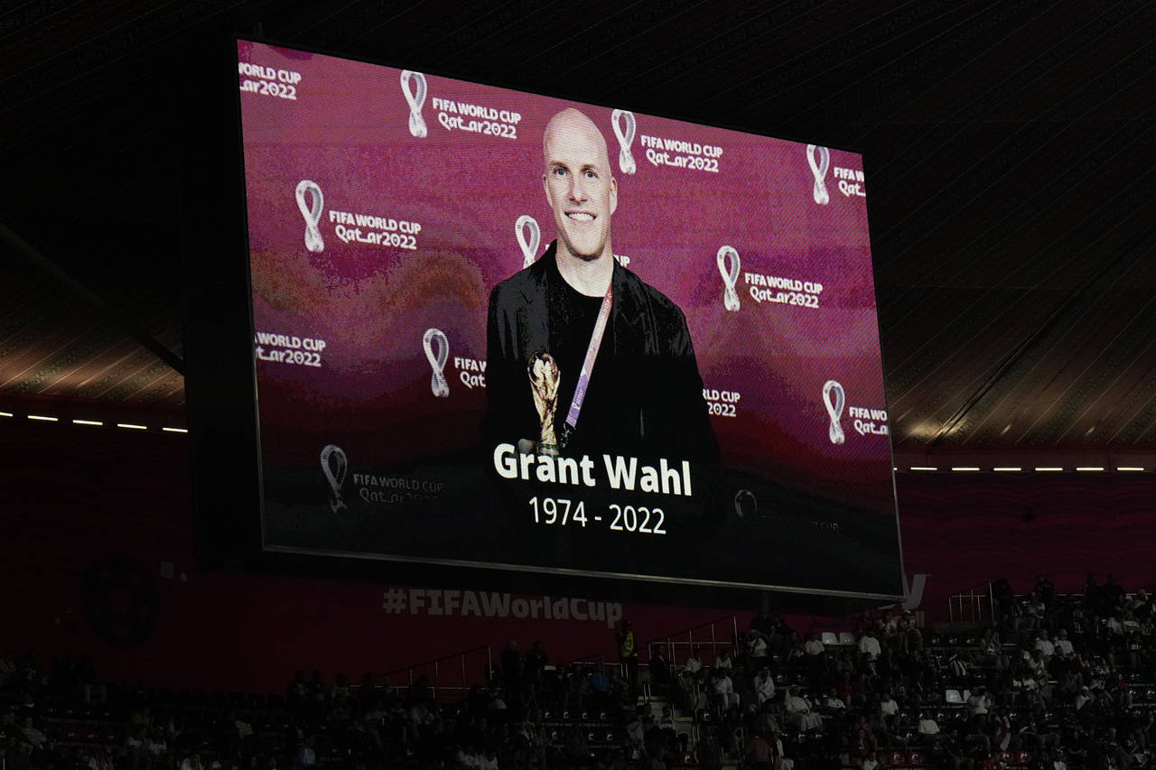FILE - A tribute to journalist Grant Wahl is displayed on a screen before the World Cup quarterfina...