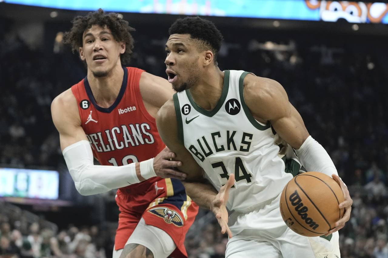 Milwaukee Bucks' Giannis Antetokounmpo drives past New Orleans Pelicans' Jaxson Hayes during the fi...
