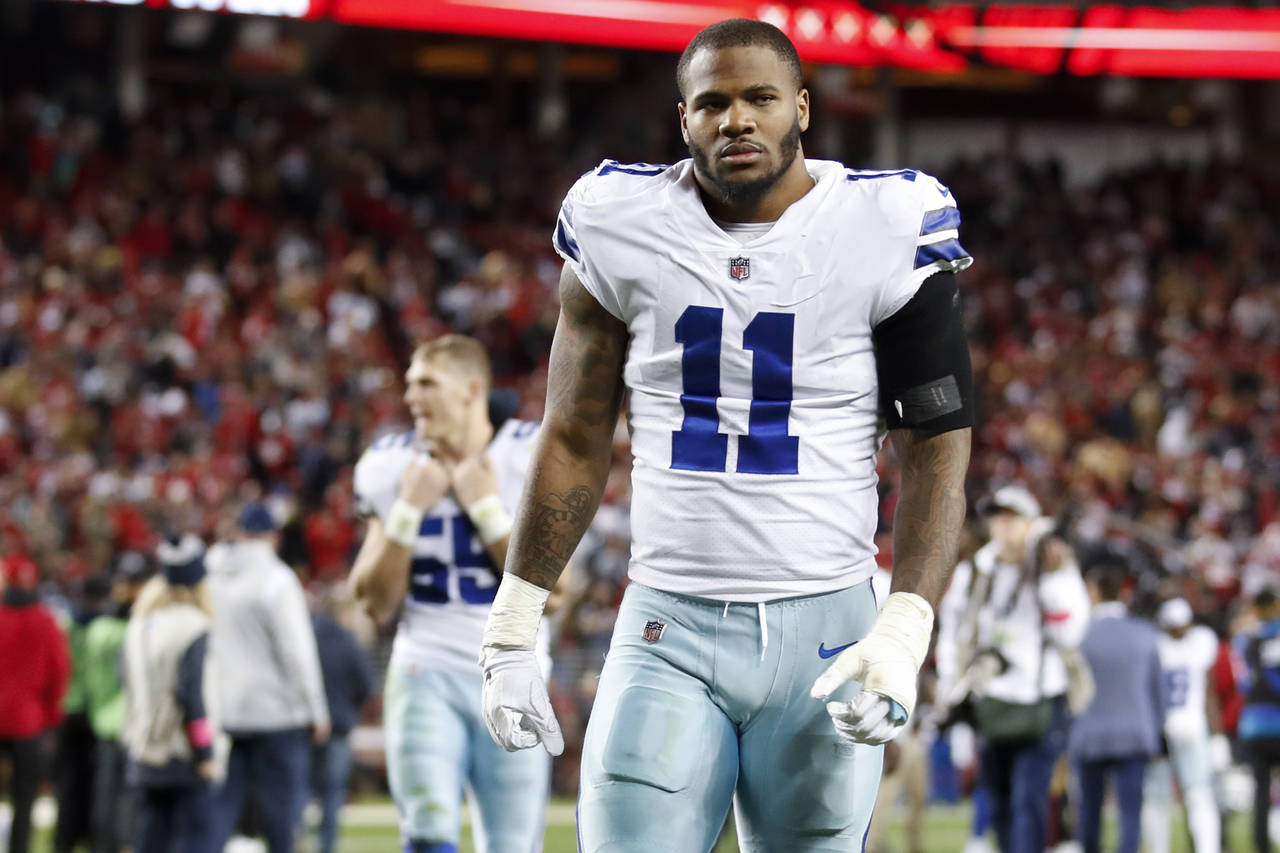 Dallas Cowboys linebacker Micah Parsons (11) walks off the field after an NFL divisional round play...