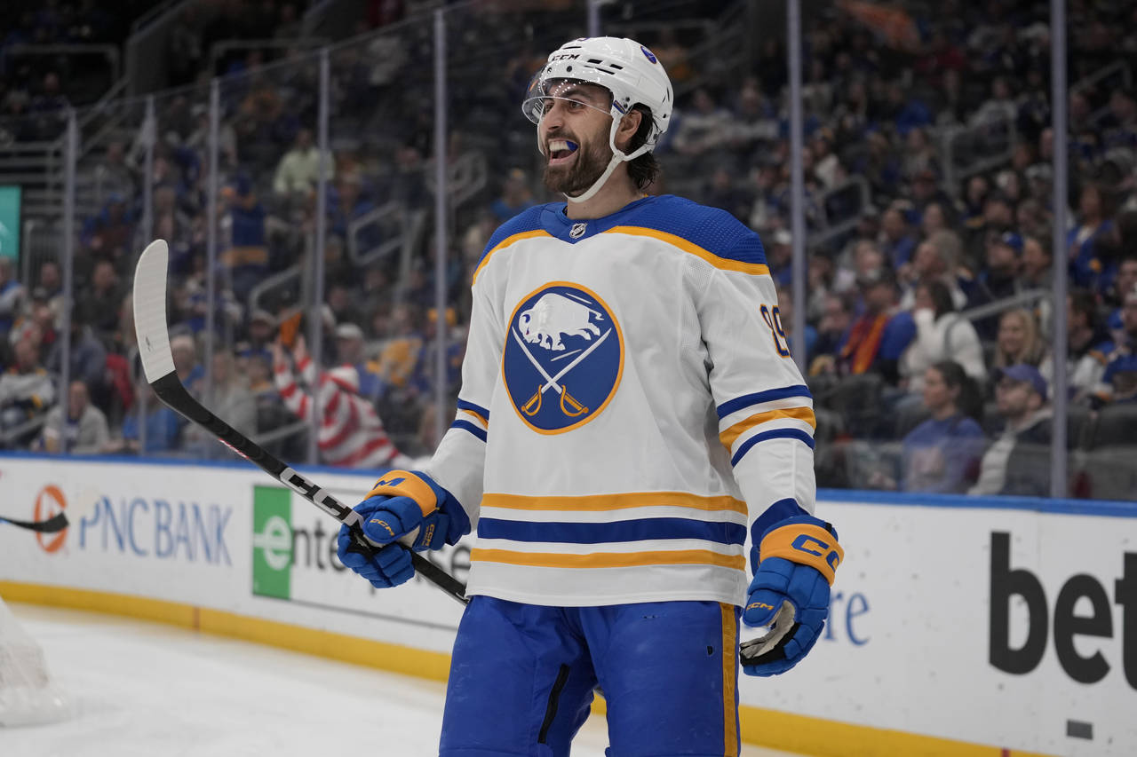 Buffalo Sabres' Alex Tuch celebrates after scoring during the first period of an NHL hockey game ag...