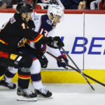 Dube scores in OT, Flames beat Blue Jackets 4-3