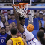 Adams scores late, No. 2 Kansas edges No. 14 Iowa St 62-60