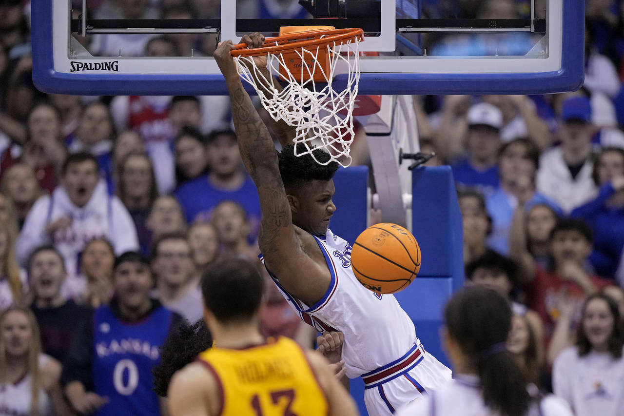 Kansas forward K.J. Adams Jr. (24) dunks the ball during the second half of an NCAA college basketb...