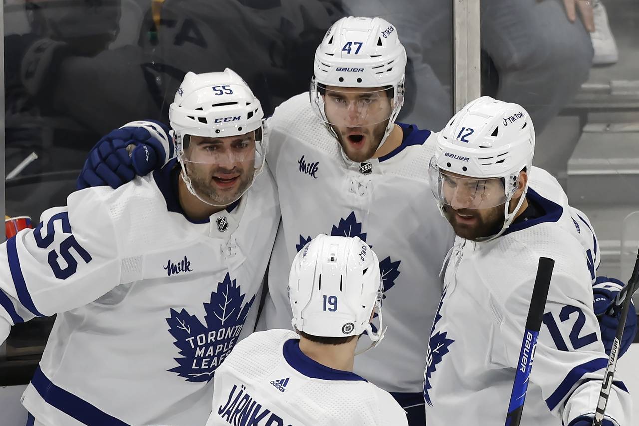 Toronto Maple Leafs' Pierre Engvall (47) celebrates his goal against the Boston Bruins with Mark Gi...