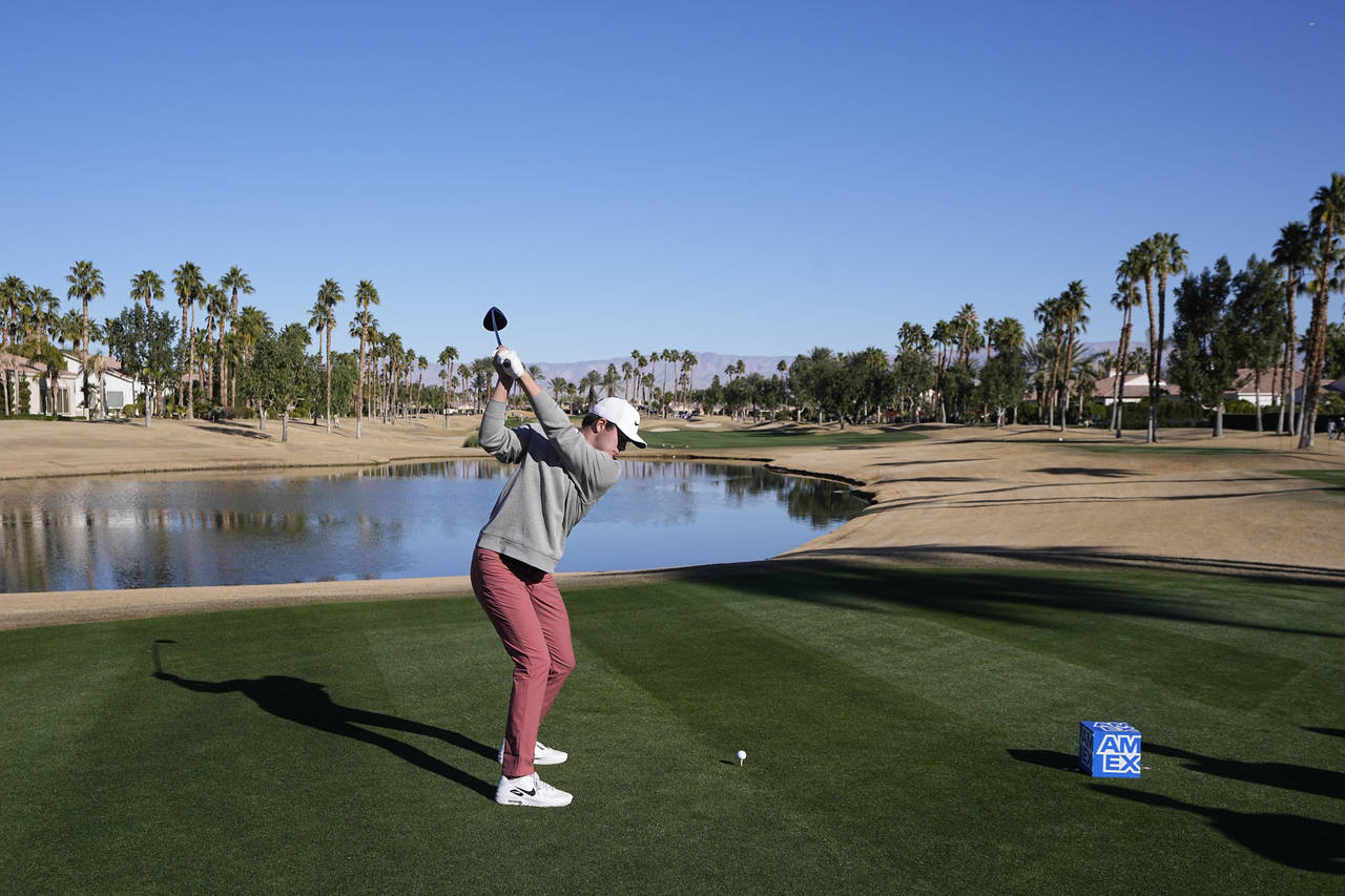 Davis Thompson hits from the 13th tee during the American Express golf tournament on the Nicklaus T...