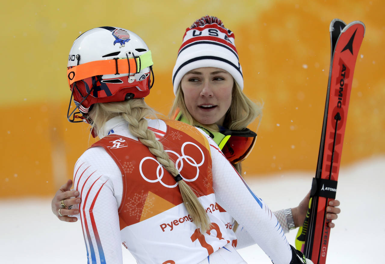 FILE - Mikaela Shiffrin, of the United States, right, hugs compatriot Lindsey Vonn after the women'...