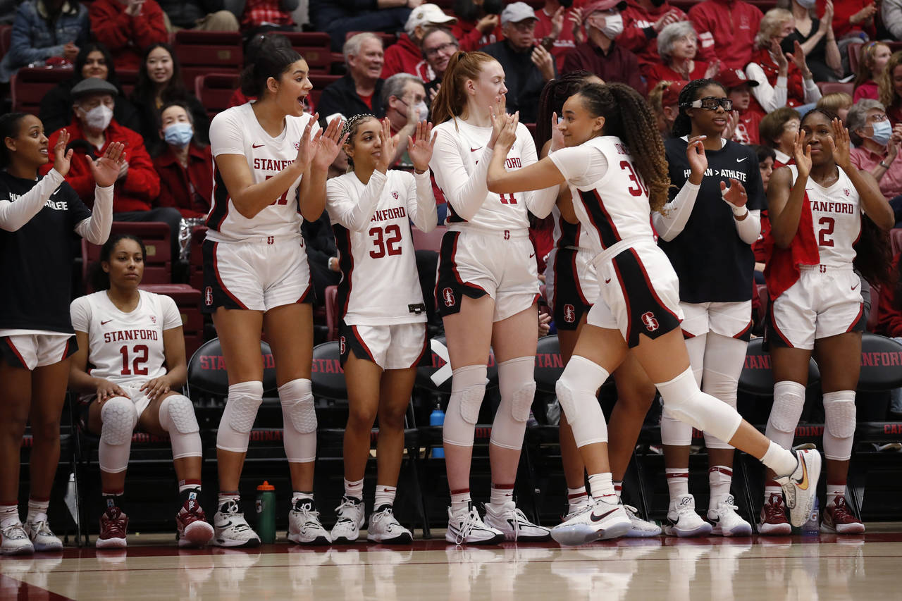 Stanford guard Haley Jones (30), front right, celebrates with forward Ashten Prechtel (11), after f...