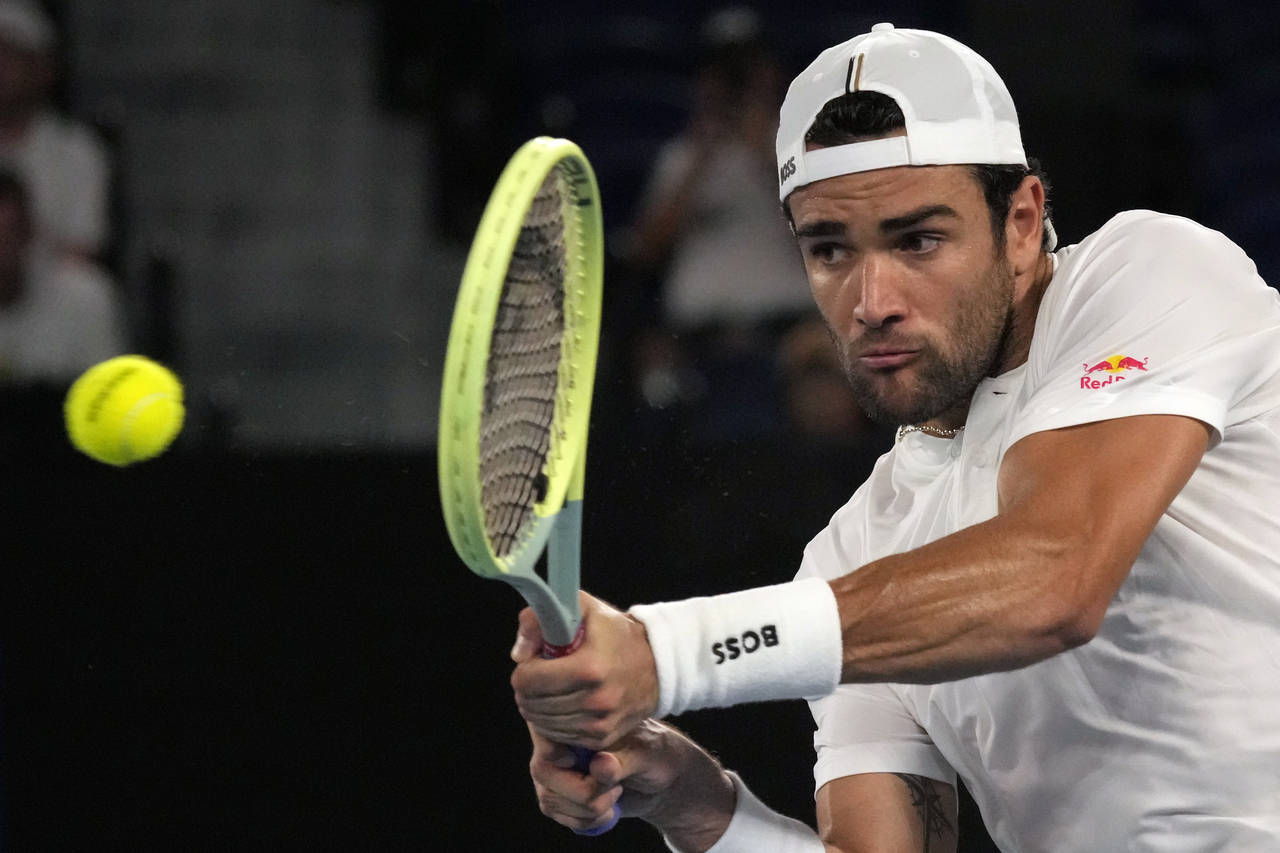 Matteo Berrettini of Italy plays a backhand return to Andy Murray of Britain during their first rou...