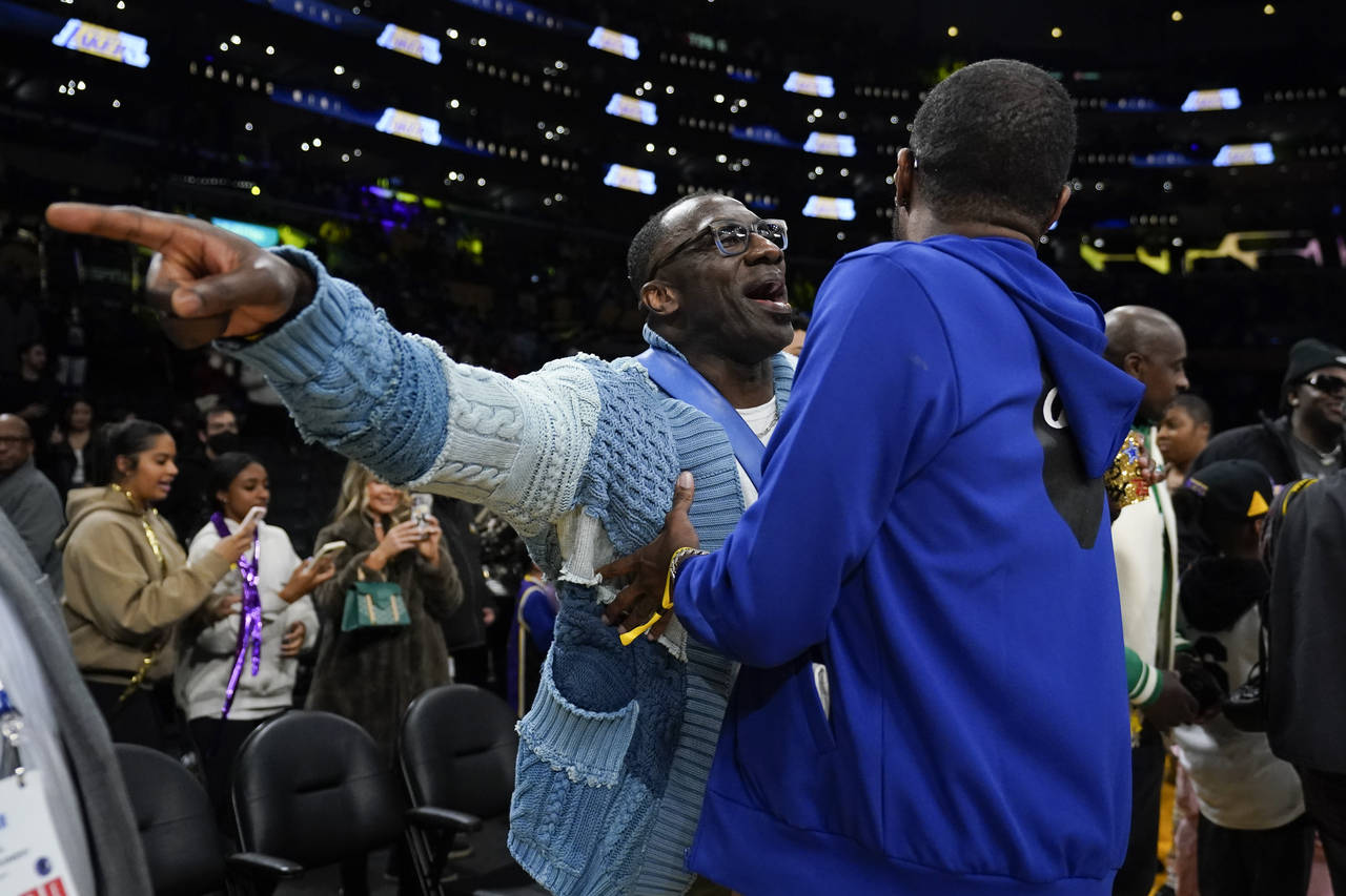Former NFL player Shannon Sharpe, left, talks with Tee Morant, father of Memphis Grizzlies guard Ja...