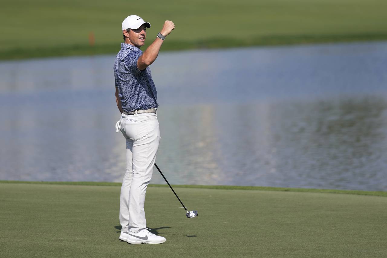 Rory McIlroy of Northern Ireland celebrates after he won the the Dubai Desert Classic, in Dubai, Un...