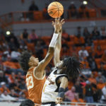 Carr, tough defense lead No. 6 Texas past Oklahoma St. 56-46