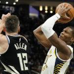 Holiday sparks late rally as Bucks beat Pacers 132-119