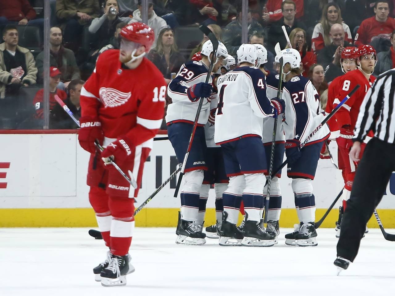 Detroit Red Wings center Andrew Copp (18) skates off as Columbus Blue Jackets left wing Patrik Lain...