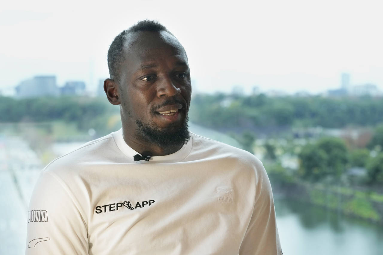 FILE - Retired Jamaican sprinter Usain Bolt speaks during an interview in Tokyo, Thursday, Dec. 1, ...