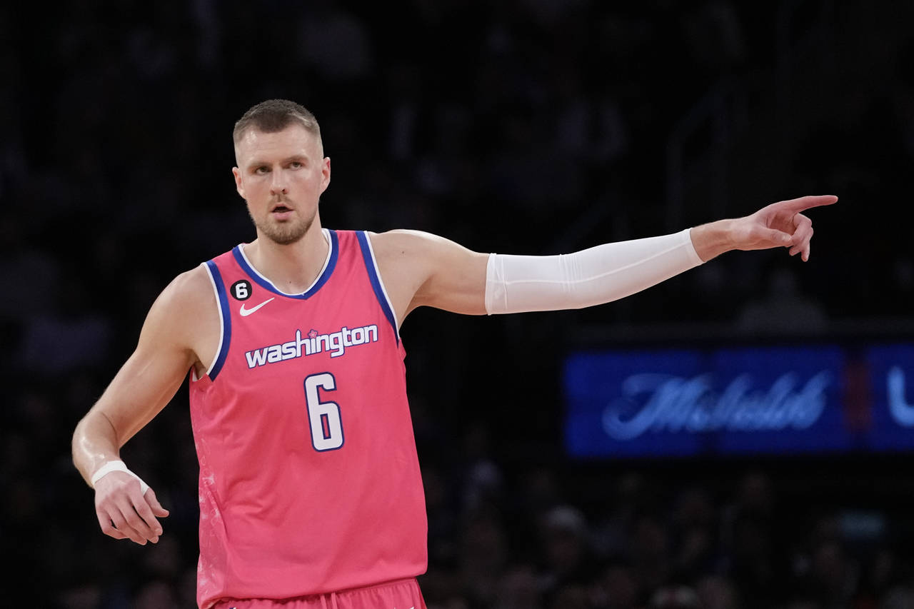 Washington Wizards center Kristaps Porzingis gestures after shooting a 3-point basket during the se...