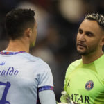 Bruised Ronaldo scores twice to edge showdown with Messi
