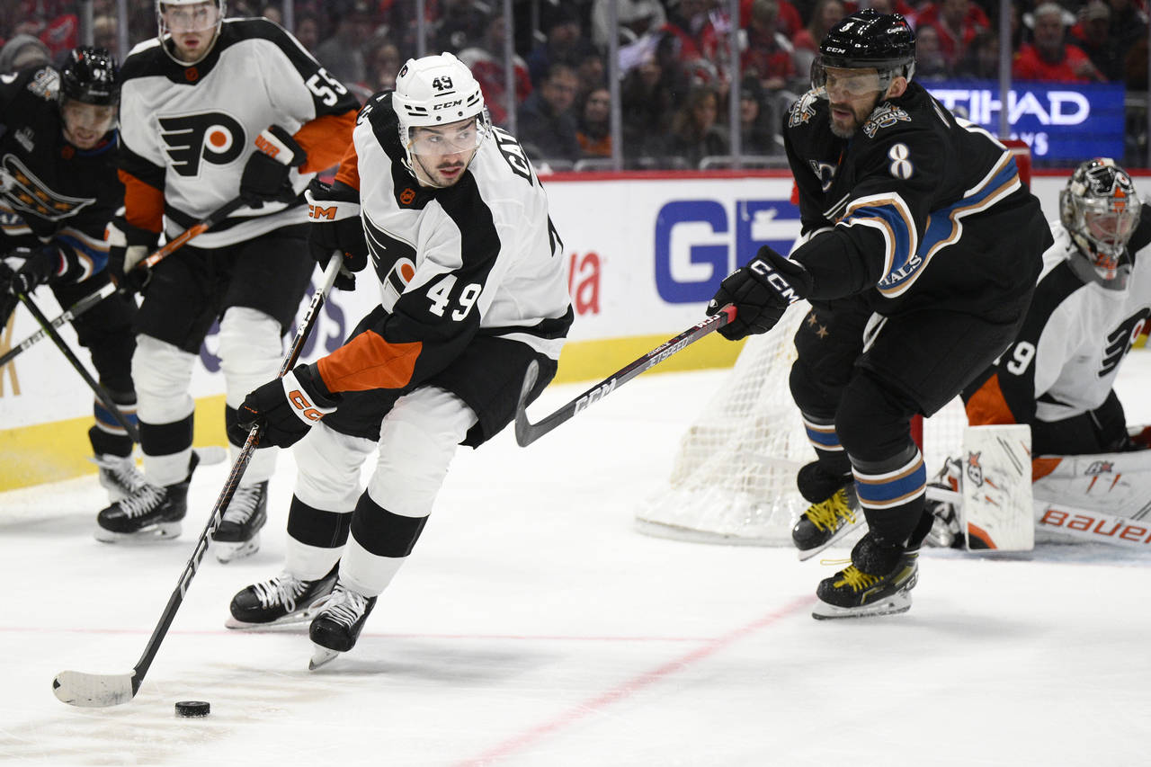 Philadelphia Flyers left wing Noah Cates (49) skates with the puck against Washington Capitals left...