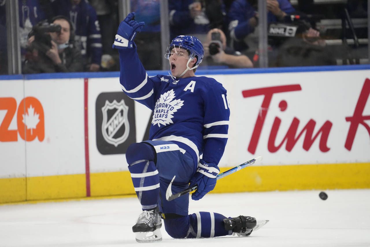 Toronto Maple Leafs right wing Mitchell Marner (16) celebrates after scoring on Nashville Predators...