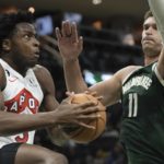 Holiday scores season-high 37, Bucks beat Raptors 130-122