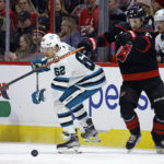 Martin Necas leads Hurricanes past Sharks 5-4 in overtime