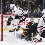 Canucks beat Blackhawks 5-2 in Tocchet's debut as coach
