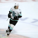 
              Seattle Kraken's Jared McCann smiles after recording a hat trick during the third period of the team's NHL hockey game against the Chicago Blackhawks on Saturday, Jan. 14, 2023, in Chicago. (AP Photo/Charles Rex Arbogast)
            