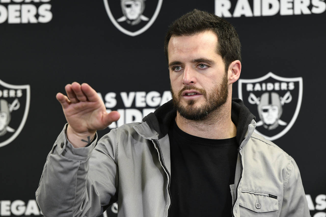 Las Vegas Raiders quarterback Derek Carr meets with reporters after an NFL football game against th...