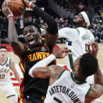 Holiday, Lopez help Bucks hold off Hawks, 114-105