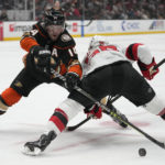 Hughes, Bratt lead Devils' 6-2 rout of Ducks
