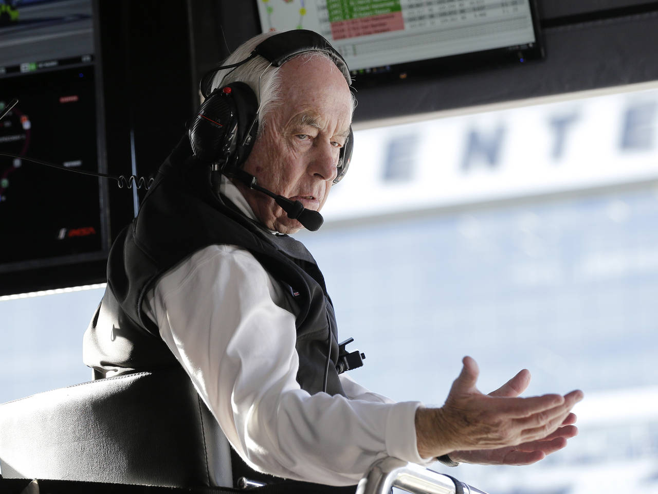 FILE - Acura Team Penske owner Roger Penske gestures to a crew member during the Rolex 24 hour auto...