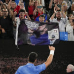 Novak Djokovic gets warm Australian Open welcome, then wins