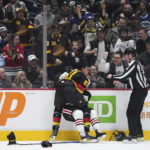 Canucks beat Blackhawks 5-2 in Tocchet's debut as coach