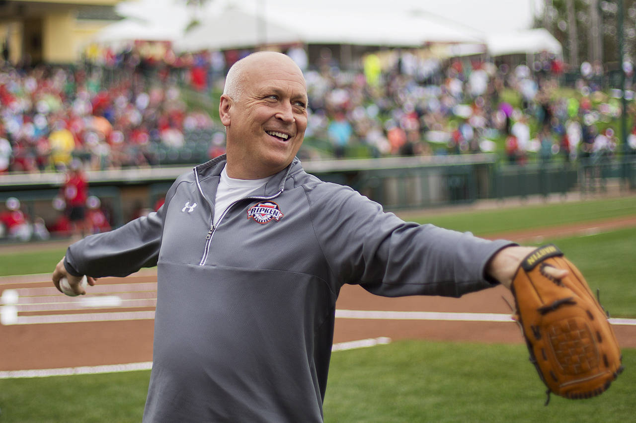 FILE -Former Baltimore Orioles' Cal Ripken Jr., throws the ball around before the start of an exhib...