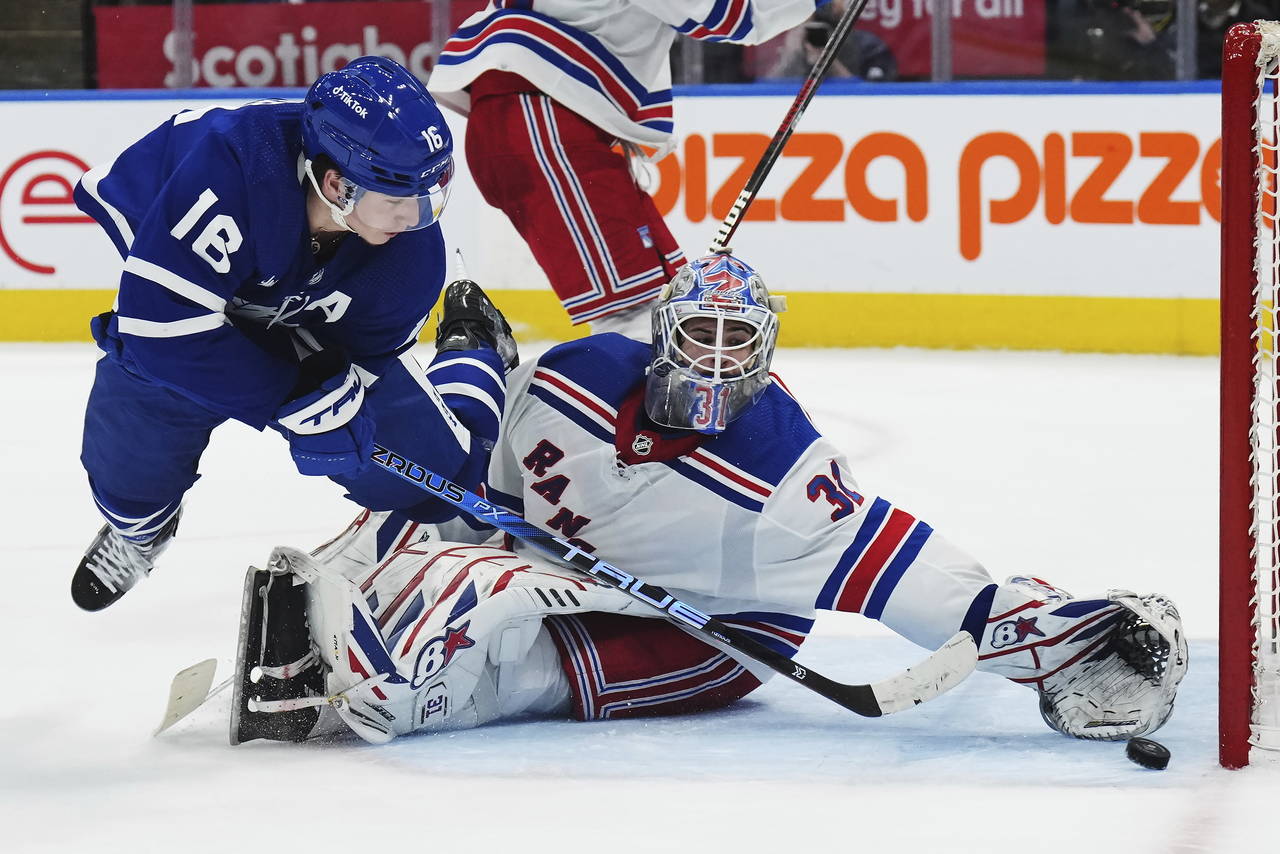 Toronto Maple Leafs forward Mitchell Marner (16) scores in overtime against New York Rangers goalte...