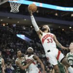 Holiday scores season-high 37, Bucks beat Raptors 130-122