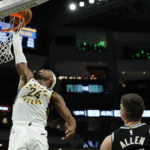 Holiday sparks late rally as Bucks beat Pacers 132-119