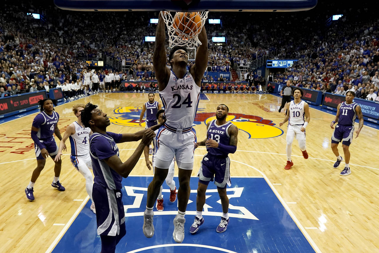 Kansas forward K.J. Adams Jr. (24) dunks the ball during the first half of an NCAA college basketba...