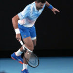 Djokovic bothered by leg, heckler during Australian Open win