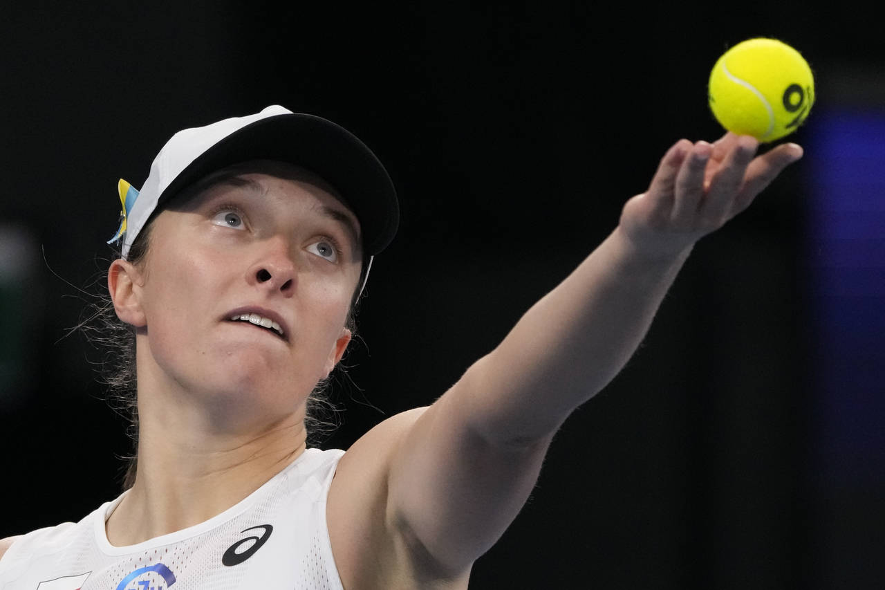 Poland's Iga Swiatek serves to United States' Jessica Pegula during their semifinal match at the Un...