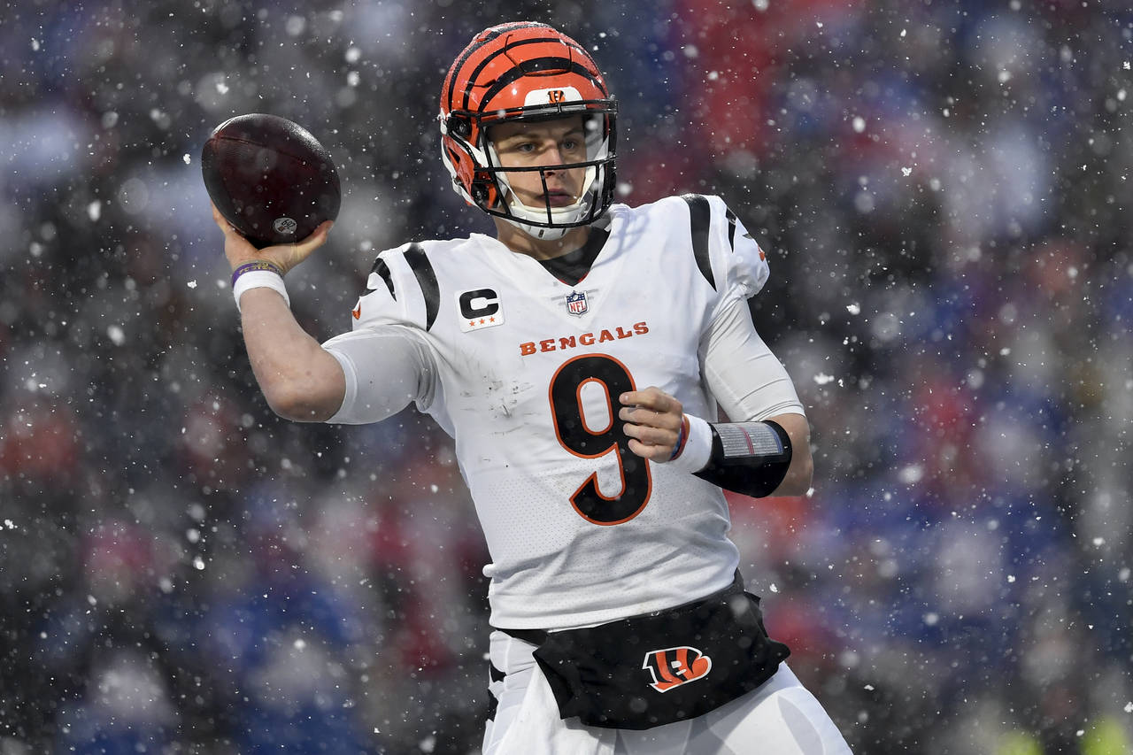 Cincinnati Bengals quarterback Joe Burrow (9) passes against the Buffalo Bills during the third qua...