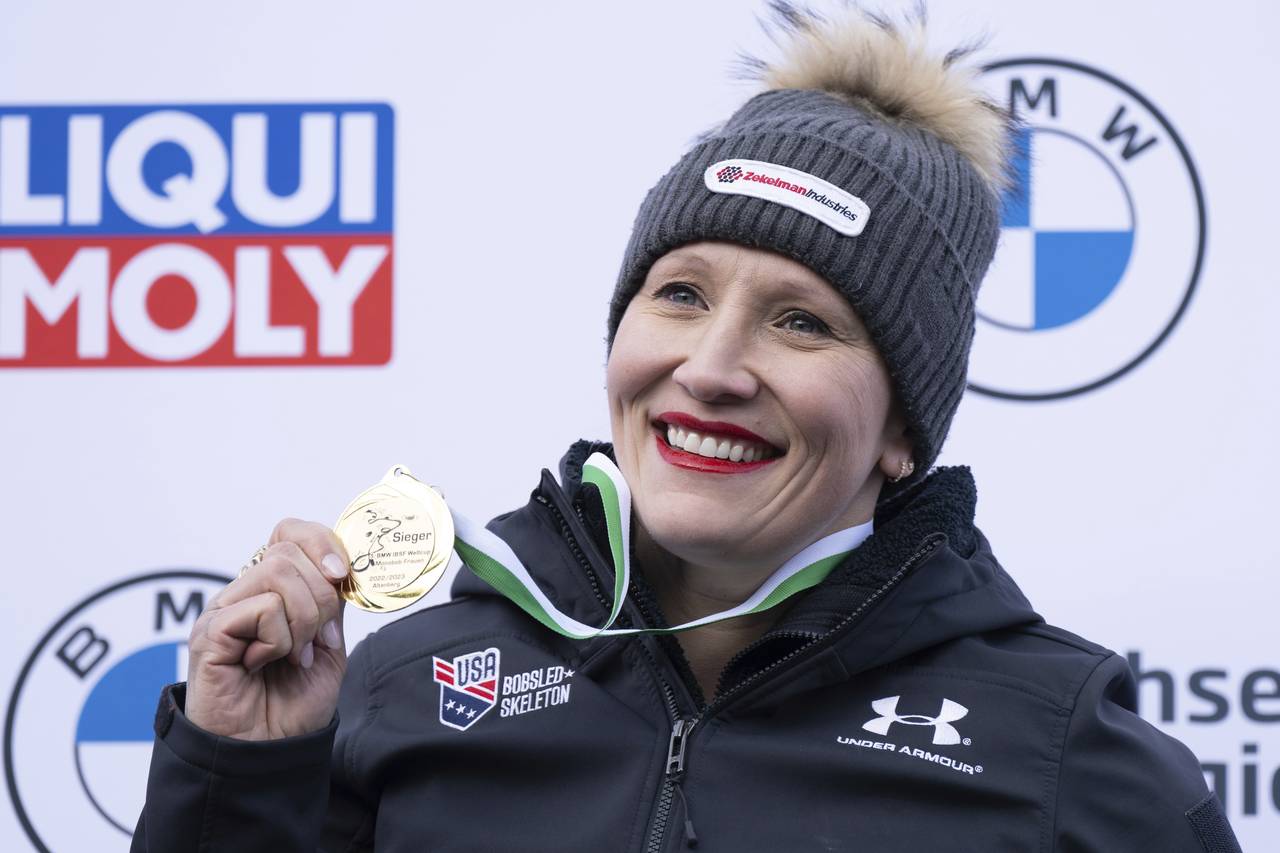 First placed Kaillie Humphries from the USA stands on the podium during the award ceremony  for the...