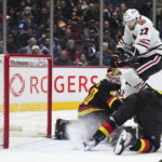 Canucks beat Blackhawks 5-2 in Tocchet's debut as coach
