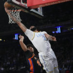 James has triple-double, leads Lakers past Knicks in OT