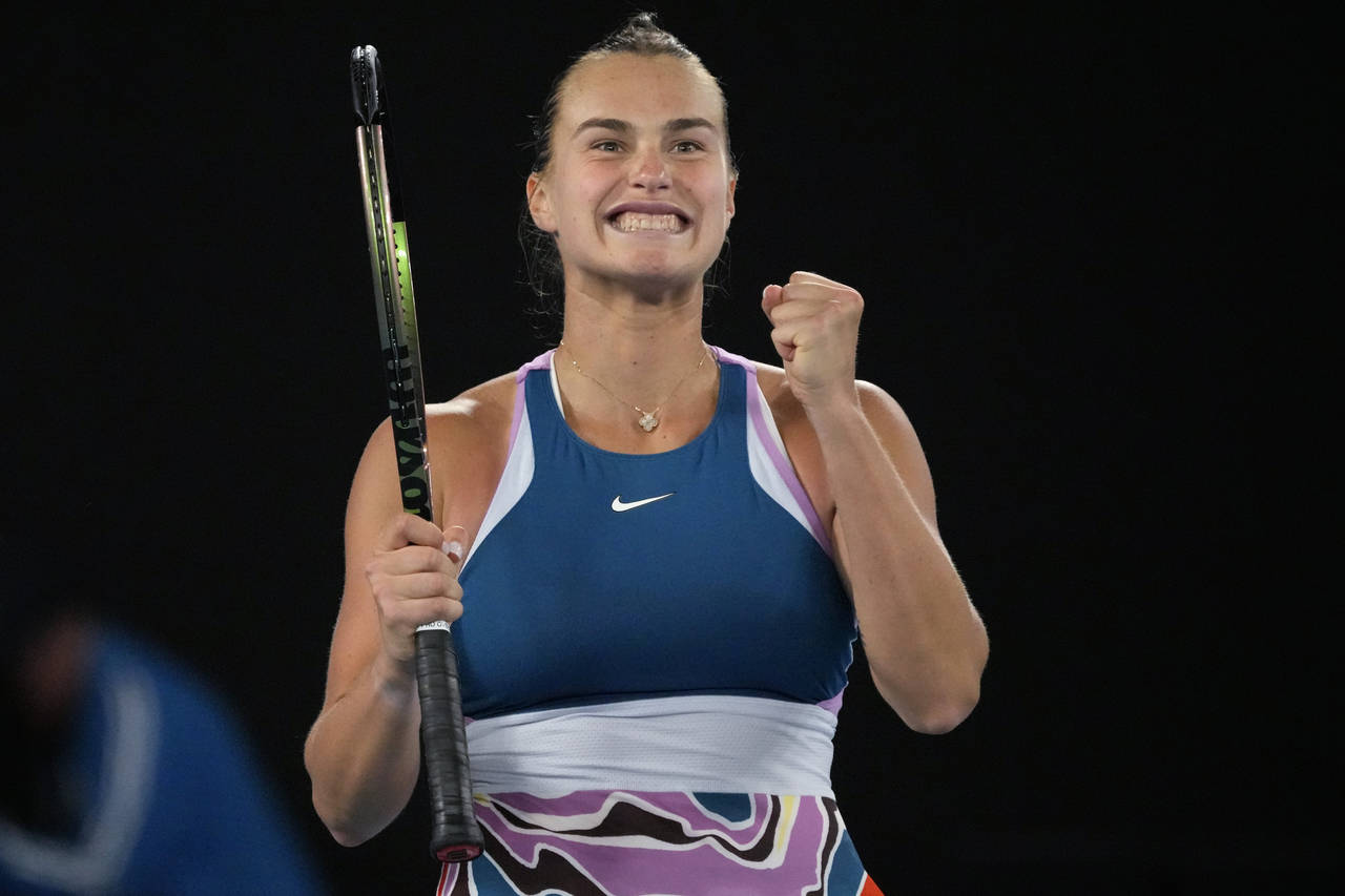 Aryna Sabalenka of Belarus celebrates after defeating Magda Linette of Poland during their semifina...