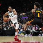 Holiday, Lopez help Bucks hold off Hawks, 114-105