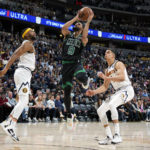 Jokic has triple-double, Nuggets top Celtics after rim delay