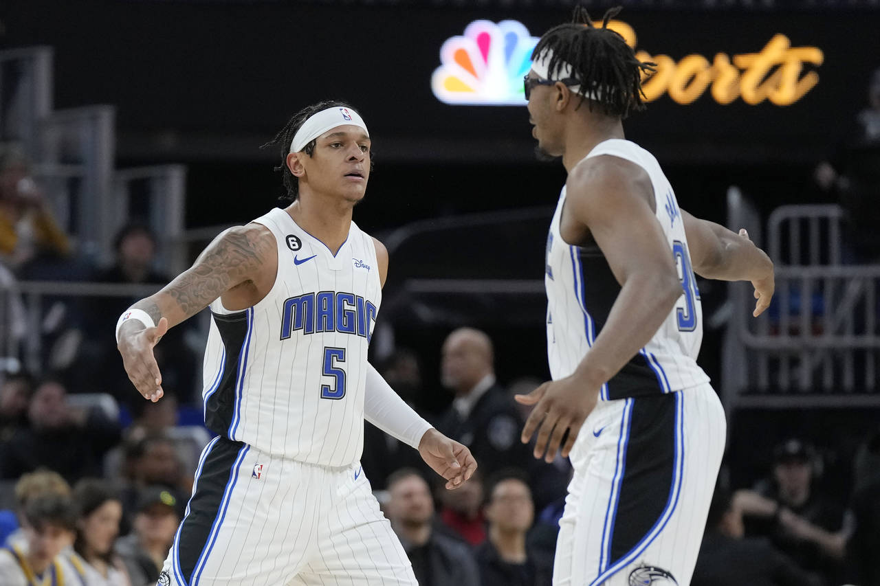 Orlando Magic forward Paolo Banchero (5) celebrates with center Wendell Carter Jr. during the first...